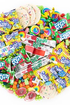 a pile of assorted candy and crackers on a white background