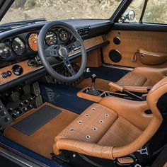 the interior of an old car with leather seats