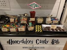 a candy bar with honeybukes, candy bars and candies on the counter