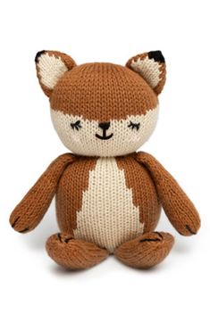 a brown and white knitted teddy bear