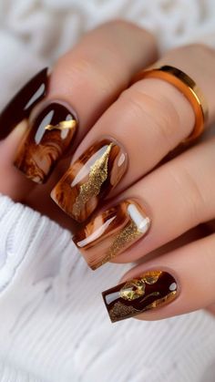 These 20+ Thanksgiving Nails Are Blowing Up on Pinterest! Get inspired with these Thanksgiving Nail Designs that are perfect for the season! From elegant Thanksgiving Nails to creative Thanksgiving Nail Ideas, you'll find everything you need to make your nails pop. Explore a variety of Thanksgiving Nail styles, including unique Thanksgiving Nail Design options and cozy Fall Thanksgiving Nails. Discover the latest Thanksgiving Nails Design Fall trends and get ready to impress with these fabulo... Marbled Nail Art, Butterscotch Nails, Reddish Brown Nails, Hozier Nails, Fall Marble Nails, Brown Marble Nails, Thanksgiving Nails Design Fall, Nail Inspired, Fall Thanksgiving Nails