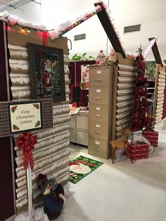 an office decorated for christmas with boxes and presents