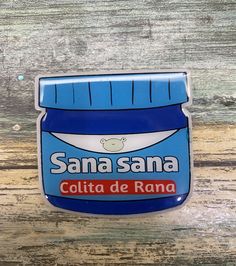 a blue and white badge with the words santa santa cola de rana on it