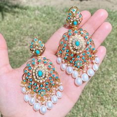 Featuring a pair of gold plated silver earrings embellished with pearls and turquoises. These earrings will add a touch of elegance and sophistication to any look. Catching the light, they'll be sure to make a statement. The earrings close with a bombay screw Simple Kurti, Jewellery Board, 22k Gold Jewelry, Pearl Necklace Set, Gold Jewelry Necklace