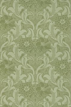 a green wallpaper with flowers and leaves on the side, in an ornate pattern