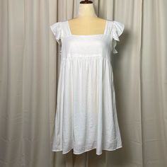 Fully Lined With Side Zipper! Has A Baby Doll Silhouette With A Flutter Sleeve. So Adorable And Perfect For Summer!! Never Worn Nwt! White Flutter Sleeve Mini Dress For Vacation, White Sun Dress, Doll Silhouette, Babydoll Style Dress, Mixed Media Dress, Sleeveless Denim Dress, Cheetah Dress, White Sundress, Goddess Dress