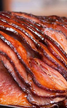 sliced bacon sitting on top of a cutting board