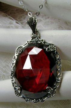 "Red Garnet Cubic Zirconia (CZ) Pendant Bubble Design#P10 Custom Made Inspired by Victorian era designs, this lovely Antique reproduction is lovingly hand-crafted in sterling silver. The flawless 22 carat faceted red garnet CZ is 24mm x 18mm. The entire pendant is 1.5\" long and 7/8\" wide. The chain (if chosen) is adjustable between 18-20\". The necklace is marked 925 for sterling silver. Notice the beautiful craftsmanship of the vintage filigree setting. This pendant necklace is a fantastic re Red Ruby Jewelry With Intricate Design, Luxury Red Ruby Jewelry With Intricate Design, Antique Jeweled Red Jewelry, Exquisite Red Jewelry For Gift, Red Oval Victorian Necklace, Red Filigree Jewelry For Formal Occasions, Red Gothic Gemstone Jewelry, Gothic Red Gemstone Jewelry, Gothic Red Ruby Jewelry