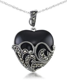 An impressive block of onyx is carved to a smooth domed heart shape. Meticulous lace work in sterling silver and genuine marcasite wrap around this dramatic pendant. Vday Jewelry, Necklaces Heart, Filigree Heart, Marcasite Jewelry, Heart Necklaces, Helzberg Diamonds, Sterling Silver Heart Pendant, Silver Jewels, Gorgeous Jewelry