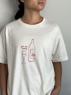 Introducing our "You Are Making New Wine" Loose Boxy Tee from Abiding Life Co.! Made from 100% Airlume, ring-spun, and combed cotton, this tee promises a luxuriously soft touch that's perfect for everyday wear. With a medium fabric weight of 6.0 oz/yd², it strikes the ideal balance between comfort and durability. The relaxed fit offers a casual, laid-back style, making it easy to pair with your favorite jeans or leggings. In a beautiful beige shade, this unisex tee features an inspiring line art Art Beige Aesthetic, French Aesthetic, Line Art Design, Boxy Tee, Christian Apparel, Beige Aesthetic, Laid Back Style, Christian Clothing, Favorite Jeans