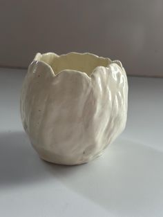 a white ceramic bowl sitting on top of a table