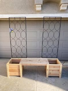 a wooden bench sitting in front of a garage door