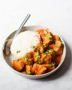 a white bowl filled with chicken and rice