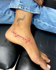 a person with a tattoo on their foot