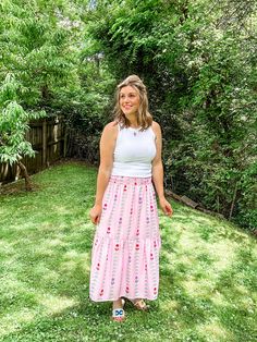 Transform your summer wardrobe with our Pink Tulip Tiered Skirt. This playful and fun piece features a stunning pattern and beautiful colors, perfect for bringing a pop of color to any outfit. With a smocked waist and lining, it not only looks great but also offers a comfortable fit. A must-have for any fashion-forward individual looking to make a statement! Fit is true to size. Emily is 5'8" wearing a medium. Small (0-4) Medium (6-8) Large (10-12) XL (14-16) Flowy Summer Maxi Skirt For Day Out, Flowy Maxi Skirt For Summer Day Out, Summer Day Out Maxi Skirt With Elastic Waistband, Trendy Summer Maxi Skirt Relaxed Fit, Trendy Relaxed Maxi Skirt For Summer, Summer Gathered Maxi Skirt For Day Out, Summer Maxi Skirt With Elastic Waistband For Day Out, Pink Tiered Skirt For Vacation, Trendy Flowy Summer Maxi Skirt