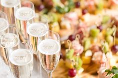 champagne flutes are lined up on a table