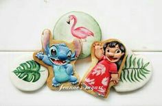 three decorated cookies with cartoon characters on them