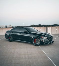 a black car parked in a parking lot