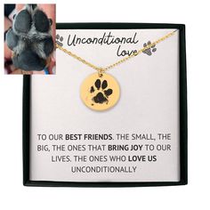 a dog's paw is shown in front of a card with an inscription on it