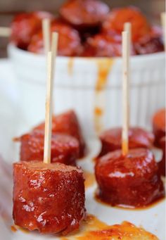 mini meatballs with toothpicks in them on a plate