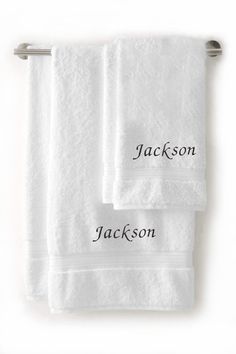 three white towels with names on them