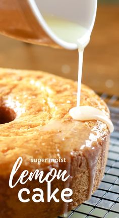 someone pouring icing onto a lemon cake on top of a cooling rack with the words, super moist lemon cake