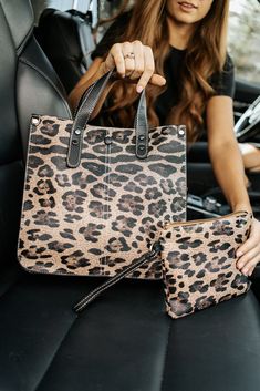 the only thing better than a brand-new purse? a purse that comes with a matching clutch! our livy shoulder bag and clutch is what your animal print accessory dreams are made of. this structured, stylish bag features: three interior pockets a top zipper to keep everything inside secure a detachable crossbody strap a wristlet clutch to wear on its own or toss in your bag to keep things organized the livy is made from soft vegan leather that is both durable and easy to keep clean. and because we kn Leopard Bag, Wristlet Clutch, Brown Leopard, Stylish Bag, Louis Vuitton Bag Neverfull, Louis Vuitton Speedy Bag, Crossbody Strap, Shoe Collection, Vegan Leather