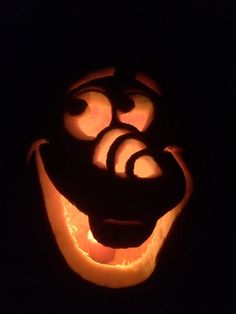 a pumpkin carved to look like an evil face