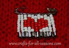 a red and white beaded bag charm