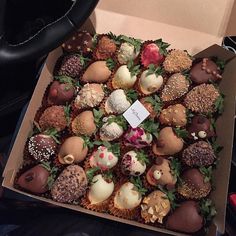 a box filled with lots of different types of chocolates