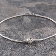 Sterling Silver Coil Charm Bracelet - Otis Jaxon Silver Jewellery Everyday Jewellery, Coil Bracelet, Sterling Silver Charm Bracelet, Wire Wrapped Bracelet, Simple Bracelets, Silver Snake Chain, Bridesmaid Bracelet, Silver Chain Bracelet, Silver Charm Bracelet