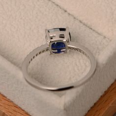 This halo ring features a 7*7mm cushion cut lab sapphire and sterling silver finished with rhodium. Customization is available. It is made by hand, and it will take about 7 days to finish the ring after your payment is completed. Any question, just let me know. :) My shop homepage: https://www.etsy.com/shop/LuoJewelry?ref=l2-shopheader-name Fancy Engagement Rings, Sapphire Ring Engagement, Black Diamond Solitaire Ring, Victorian Diamond Ring, Blue Gemstone Ring, Black Diamond Solitaire, Marquise Cut Engagement Ring, Victorian Engagement Rings, September Birthstone Rings