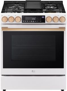 a white stove top oven with two burners and an electronic timer on the front