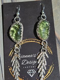 These rose cut Moldavite and silver cast cedar branch earrings are EVERYTHING! Nature-inspired Silver Earrings With Natural Stones, Cedar Branch, Branch Earrings, Rose Cut, It Cast, Silver, Design