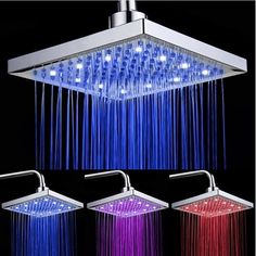 three different colors of shower head with water running from the faucet to the ceiling