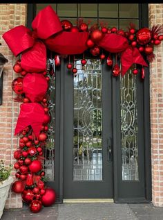 a door decorated with red ornaments and bows