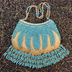 "This is a rare vintage handbag fully embellished with iridescent gold micro beads and turquoise beading. Measurements: Length - 8\" Height - 5\" + 2.5\" beaded strands Width - 1\" (thick padded interior) All of my items come from a smoke-free and pet-free home. If you have any questions, please don't hesitate to ask!" Beaded Pouch, Vintage Fringe, Micro Beads, Bee Creative, Turquoise And Gold, Vintage Handbag, Beaded Handbag, Vintage Handbags, Clutch Handbag