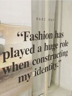 an advertisement with a teddy bear sitting on a bench in front of a window that says fashion has played a huge role when constructing my identity