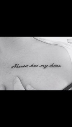 a black and white photo of a woman's chest with an inscription on it