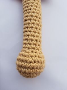 a crocheted tie on a white surface