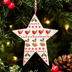 a wooden star ornament hanging from a christmas tree