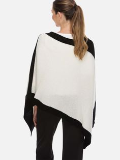 Minimal design, maximum comfort.Made with 100% cashmere, this two-tone poncho is lightweight yet warm.Its simple elegance works for both casual and polished looks. 100% cashmere: Soft, warm, and lightweight. Two-tone style: Easy to mix and match. Effortless layering: Folds easily for on-the-go styling. Year-round comfort: Breathable and cozy for all-season wear. Gift-ready: Includes a free gift box. Luxury Cashmere Chic Poncho, Luxury Oversized Shawl Poncho, Luxury Cashmere Vest For Layering, Luxury Elegant Winter Poncho, Luxury Chic Winter Poncho, Luxury Oversized White Poncho, Luxury Oversized Cozy Poncho, Elegant Luxury Poncho For Winter, Luxury Oversized Poncho For Layering