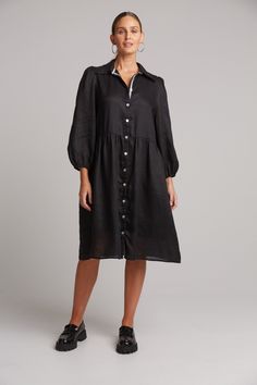 STYLE DETAILS: Shirt dresses are one of those nostalgic trends that always seem to make a comeback. The Studio Midi Shirt Dress is the perfect piece for everyday wear, made from luxurious linen. It features a button-down front and long balloon sleeves for a relaxed yet stylish look. The inside placket is lined with a contrast ribbon, adding extra detail. Pair it with sneakers or boots to suit your occasion. FEATURES: Collar Button-down Balloon sleeves Gathered waist Midi length 100% Linen Lining: 100% Rayon Contrast: 100% Polyester XS, S, M, L, XL Black Collared Dress With Relaxed Fit, Black Relaxed Fit Collared Dress, Black Shirt Dress With Placket For Spring, Elegant Mid-length Relaxed Fit Dress, Elegant Mid-length Dress With Relaxed Fit, Relaxed Fit Knee-length Dress With Button Closure, Knee-length Daywear Dresses With Button Cuffs, Black Collared Dress With Placket, Summer Formal Dresses With Relaxed Fit