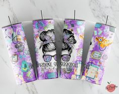 three toothbrush holders decorated with purple and white designs on marble counter top next to each other