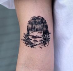 a woman's arm with a black and white drawing of a girl in the water