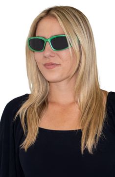 Polarized lenses mean color-true clarity in smart sunglasses that fuse form and function. Includes transparent travel case and microfiber cloth 72mm lens width; 21mm bridge width; 122mm temple length 100% UV protection Polycarbonate Imported Green Plastic Sunglasses For Outdoor Use, Green Plastic Sunglasses For Outdoor, Outdoor Green Plastic Sunglasses, Green Plastic Sunglasses With Uv Protection, Green Mirrored Sunglasses In Plastic, Modern Green Shield Sunglasses With Uva Protection, Functional Green Sunglasses With Uv Protection, Modern Green Tinted Shield Sunglasses, Green Anti-reflective Cat Eye Sunglasses