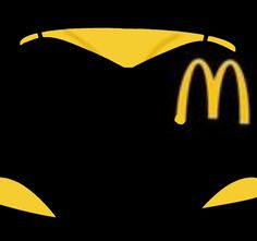 a mcdonald's logo is shown in the shape of a batman mask with yellow eyes