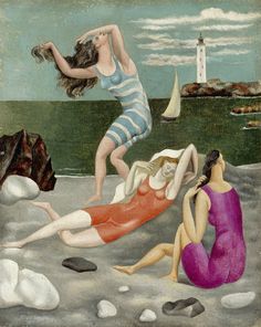 two women in bathing suits are on the beach and one woman is holding a shell