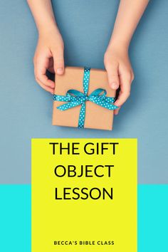 the gift object lesson is being held by two hands with a present wrapped in blue ribbon