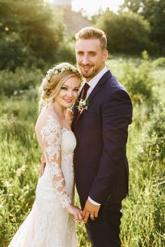 the bride and groom are posing for pictures